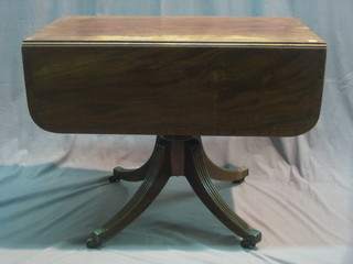 A Georgian pedestal mahogany Pembroke table with crossbanded top, fitted 2 drawers and raised on pillar and tripod supports 36"