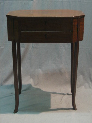 A mahogany lozenge shaped work table with hinged lid, the base fitted a drawer, raised on square tapering supports 23"