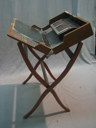An Edwardian walnut folding campaign writing table, 22"