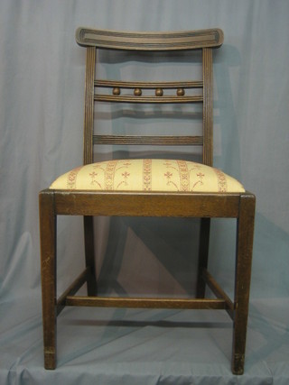 A set of 6 Georgian style bar back dining chairs with upholstered drop in seats, raised on square tapering supports