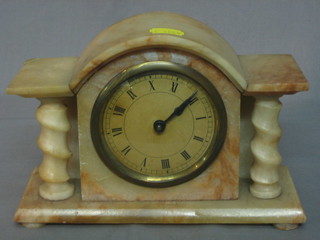 A 1930's bedroom timepiece contained in an alabaster arch shaped case