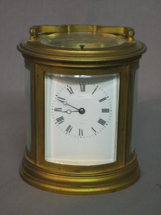 A Victorian repeating carriage clock contained in an oval case by Martin & Co