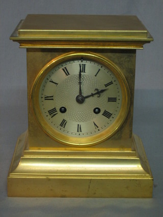 A 19th Century French 8 day striking mantel clock with silvered dial contained in a gilt metal case