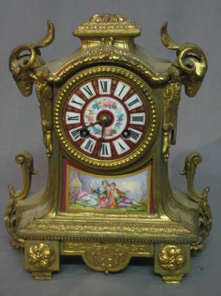A 19th Century French 8 day mantel clock contained in a gilt ormolu case with porcelain dial and porcelain plaque decorated reclining figures