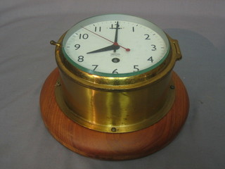 A Smiths Astral wardroom style clock, the 6" dial with Arabic numerals contained in a brass case