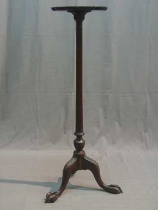 A Chippendale style mahogany torchere with bracketed border, turned and fluted column, raised on cabriole, egg and claw feet, by Denby & Spinks of Leeds