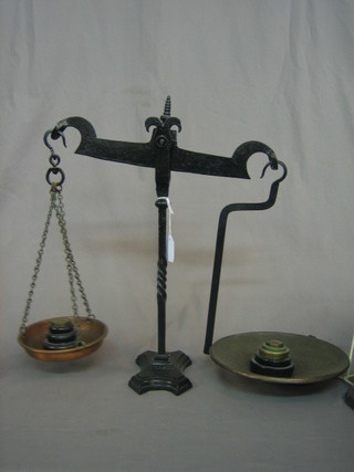A pair of Victorian wrought iron scales complete with weights