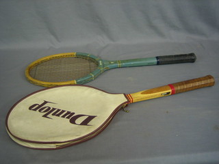 A Dunlop tennis racquet and 1 other