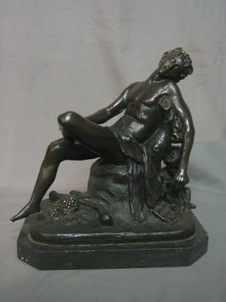 A reproduction bronze figure of a reclining classical gentleman 11"
