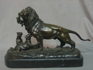 A reproduction bronze figure of a lion and cubs, raised on a marble base 14"