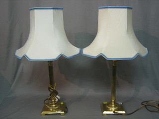 A pair of gilt metal reeded table lamps 12"