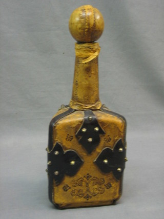 A triangular leather covered decanter 12"