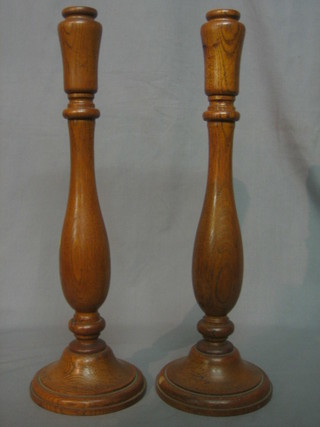 A pair of oak turned candlesticks from oak of HMS Cambridge fought at Pembroke 1858, broken up 1908 17"