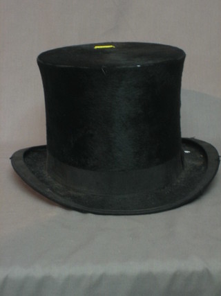 A gentleman's silk top hat
