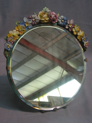 A 1930's Art Deco circular bevelled plate easel mirror with Barbola mounts 9"