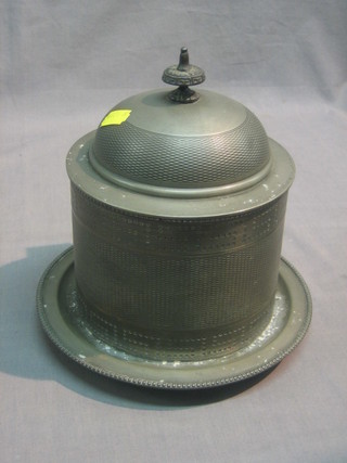 A cylindrical pewter biscuit barrel and cover with hinged lid