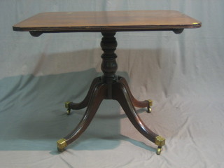 A Regency mahogany rectangular snap top breakfast table raised on column and tripod supports ending in brass caps and castors 37"