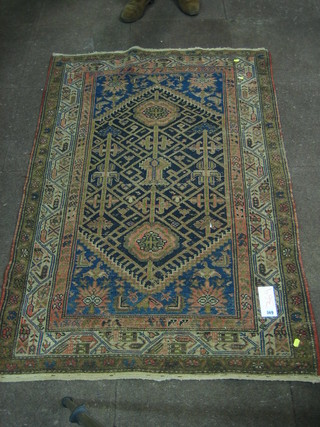 A blue ground Caucasian rug 61" x 39"