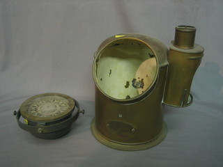 A Marine compass by Henry Hughes & Sons contained in a brass binnacle