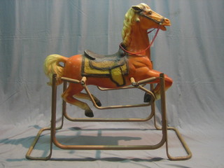 A 1960's plastic and metal rocking horse