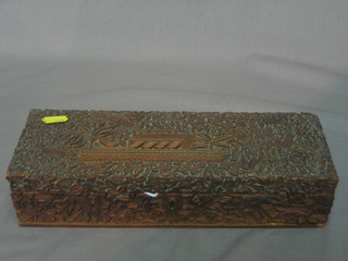 A rectangular Eastern carved wooden box with hinged lid 11"