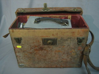A Newman Sinclair 35mm wind up camera, contained in a leather box, the lid marked Paul Rotha Productions  (belonged to renowned film documentary maker and film historian Paul Rotha)