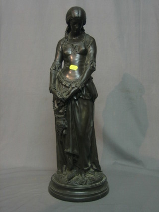 A reproduction Art Nouveau style bronzed of a standing lady 23"