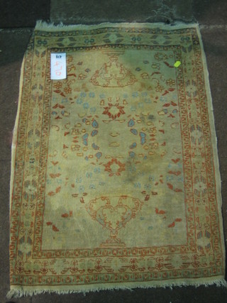 A white ground Persian slip rug with Eastern design 34" x 24"