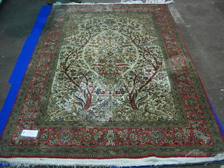 A fine quality 20th Century Persian silk rug with pink ground decorated a garden scene with mosque lamp 79" x 57"
