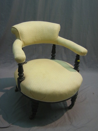 A Victorian mahogany tub back chair upholstered in cream material