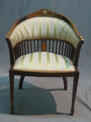 An Edwardian inlaid mahogany tub back chair raised on square tapering supports ending in spade feet