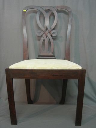 A Georgian style mahogany dining chair with pierced vase splat back, raised on square tapering supports
