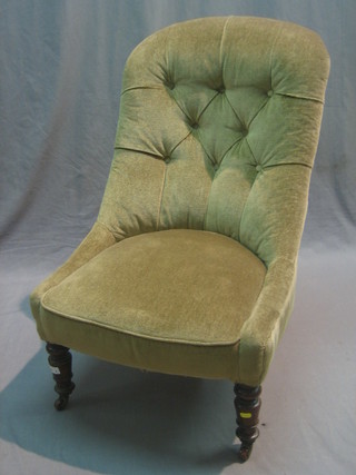 A Victorian mahogany tub back chair upholstered in green buttoned material