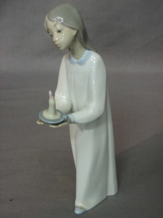 A Lladro figure of a girl in night dress with chamber stick, base marked 4-9E 7"