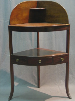 A Georgian mahogany 2 tier corner wash stand with raised galleried back, raised on square tapering supports 56"
