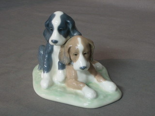 A Nao figure of 2 seated dogs 4"