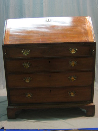 A Georgian mahogany bureau, the fall front revealing a well fitted interior above 4 long graduated drawers, raised on bracket feet 36"