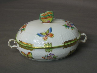 A Herend Hvngary oval twin handled jar and cover decorated butterflies, the finial in the form of a butterfly, 5"