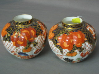 A pair of 18th/19th Century Crown Derby melon shaped vases with Imari decoration, base marked 5.74 2444, 4"