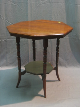 An Edwardian octagonal walnut 2 tier occasional table, raised on turned supports 24"