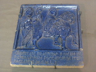 A blue glazed pottery tile decorated Pilgrim and marked Geminiani Praesidio Romam In Remissionem Peccatorvm Iter Faciamivs M.C.M.L. 10" x 9"