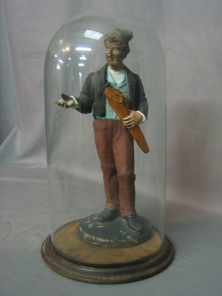 A 19th Century terracotta figure of standing umbrella vendor with glass eyes 13", complete with glass dome