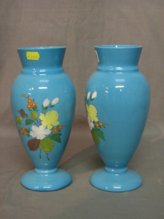 A pair of Victorian blue opaque glass vases with floral decoration 10"