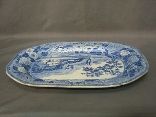 A 19th Century blue and white pottery meat plate decorated landscape scenes 17"
