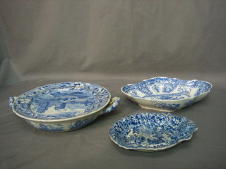 A 19th Century scallop shaped blue and white pottery dish 7" (cracked), a Spode blue and white oval dish 10" (cracked) and a Spode circular blue and white plate warmer 10"