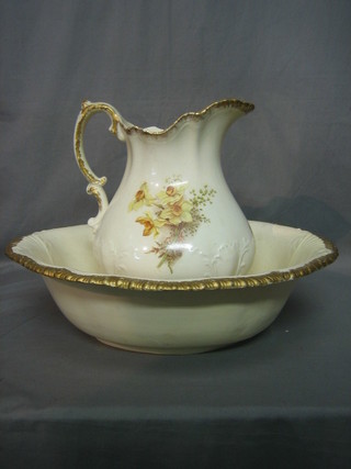 A floral patterned wash bowl and jug decorated daffodils