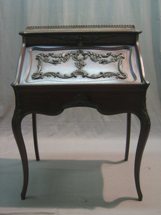 An Edwardian carved mahogany bonheur du jour, the top with three-quarter gallery, the fall front revealing a well fitted interior with well, raised on cabriole supports 28"