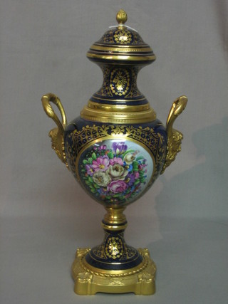 A reproduction 19th Century style blue porcelain urn and cover with gilt metal mounts and floral decoration 17"