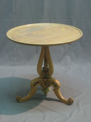 A 19th/20th Century circular bleached mahogany dish top wine table, raised on pierced column and tripod supports 21"