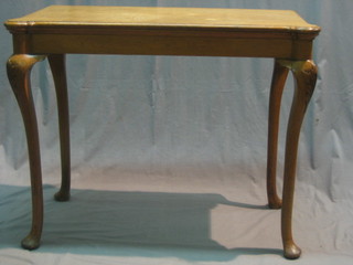 A 19th Century honey oak card table raised on cabriole supports 37"
